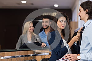 Handsome Business Man And Woman Fashion Shop, Customers Choosing Clothes In Retail Store