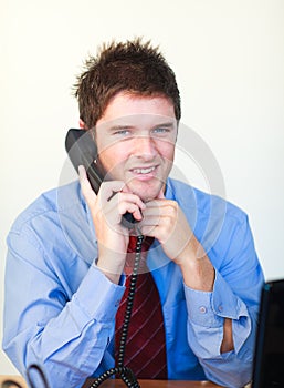 Handsome business person talking on the phone