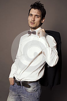 Handsome businesslike man with dark hair in elegant suit