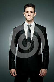 Handsome businessman in black suit.