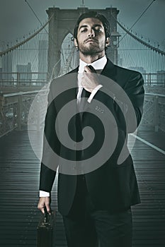 Handsome businessman and Brooklyn bridge