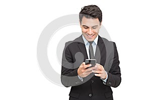 Handsome businessman checking emails and reading message on mobile phone