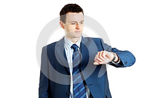 Handsome businessman checking his wrist-watch