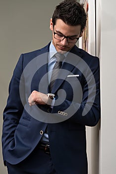 Handsome Businessman Checking Time On His Watch