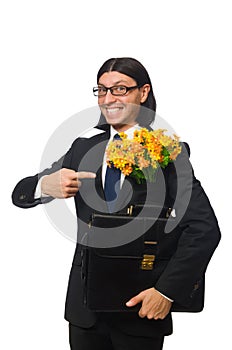 Handsome businessman with flower and brief case