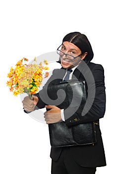 Handsome businessman with flower and brief case