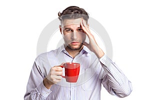 Handsome Businessman With A Headache Holding Red Cup