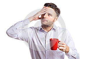 Handsome Businessman With A Headache Holding Red Cup