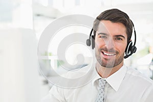 Handsome businessman with headset interacting
