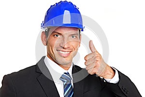 Handsome businessman in a helmet