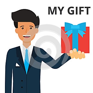 Handsome businessman holding gift box in hand.