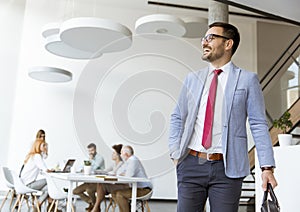 Handsome businessman leaving office