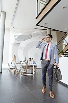 Handsome businessman leaving office