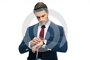 Handsome businessman looking on his wrist watch