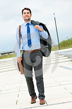 Handsome businessman or manager going home