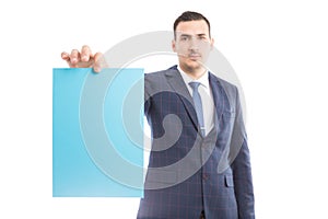 Handsome businessman or manager holding blank paper