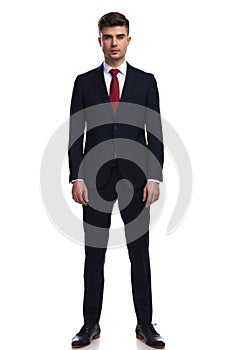 Handsome businessman posing while standing