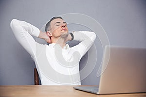 Handsome businessman sleeping at the table