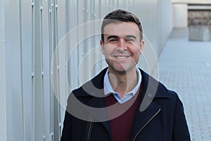 Handsome businessman smiling with copy space