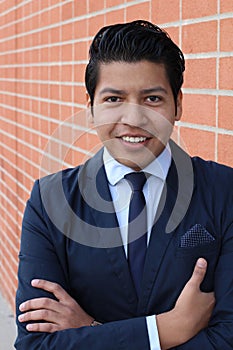 Handsome businessman smiling isolated with arms crossed