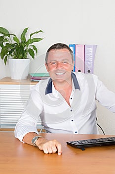 A Handsome Businessman smiling in the office