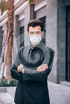 Handsome Businessman Standing in Business District and He Confident in New Business Project Among Corona Virus Covid-19 Outbreak