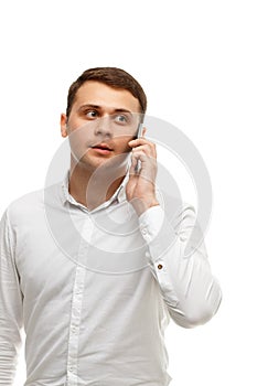 Handsome businessman talking phone isolated