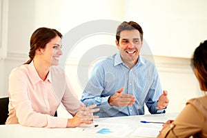 Handsome businessman talking on team meeting