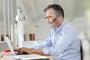 Handsome businessman teleworking photo