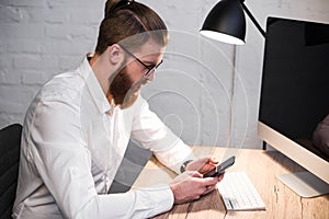 handsome businessman using smartphone