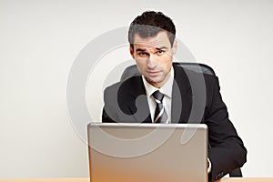 Handsome businessman works on the computer
