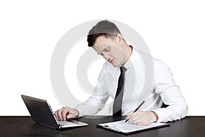 Handsome businessman writing on clipboard