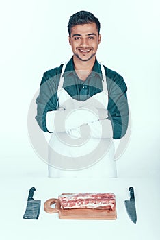 Handsome Butcher in Apron Going to Cut Meat.