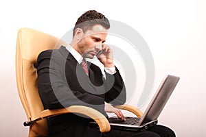 Handsome calling businessman with laptop 3