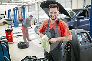 Car mechanic working at automotive service center