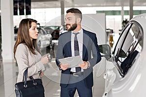 Handsome Car Salesman Talking to Client