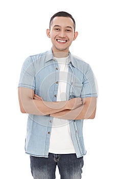 Handsome casual man smiling with armcrossed