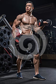 Handsome caucasian athlete muscular fitness male model execute e
