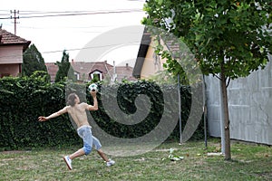 Handsome caucasian guy is working out in the nature.  Gymnastics, healthy lifestyle concept.