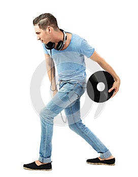 Handsome caucasian male holding vinyl disc