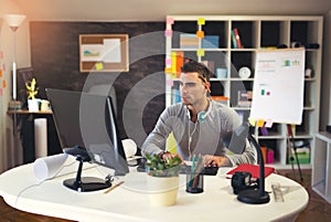 Handsome Caucasian man at work desk