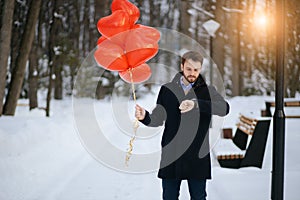 Handsome caucasian romantic guy waiting for lady on a date