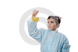 Handsome Caucasian schoolboy, a scientist chemist in a white lab coat, holding glass laboratory flasks with chemicals