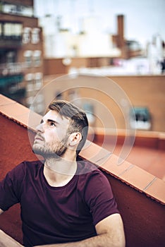 Handsome caucasian young man in casual clothes in urban environment