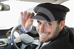 Handsome chauffeur smiling at camera