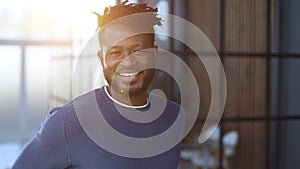 Handsome cheerful african american executive business man at the workspace office