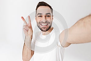 Handsome cheerful man wearing blank t-shirt