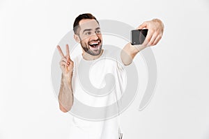 Handsome cheerful man wearing blank t-shirt