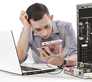 Handsome computer specialist look confuse repairing computer