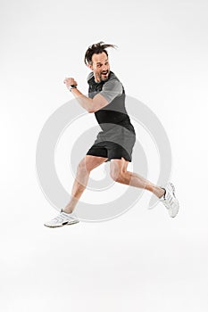 Handsome concentrated mature sportsman running